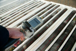 man using xrf gun on lead paint